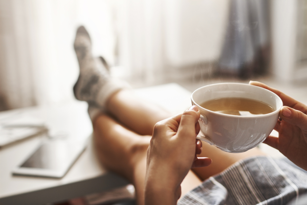 drinking a cup of tea