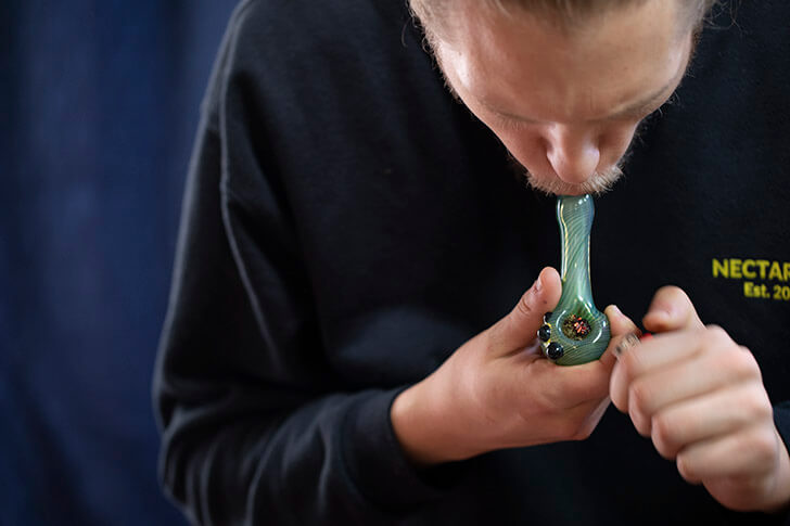 Smoking from a pipe 