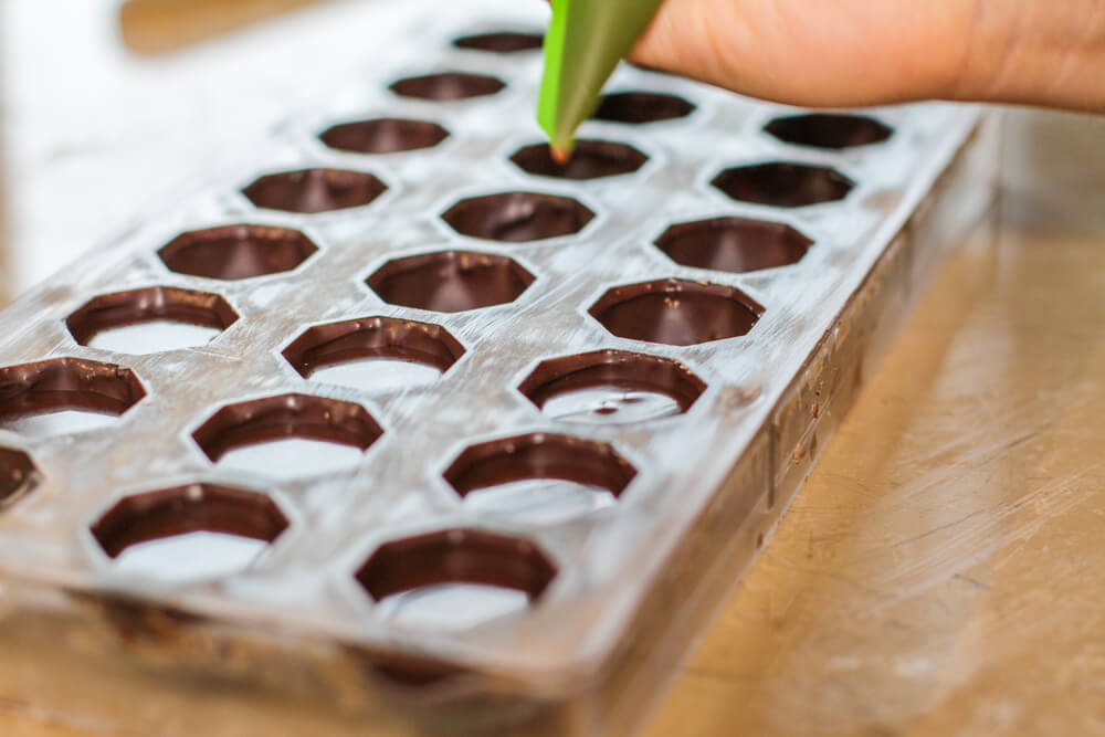 Filling candy molds 