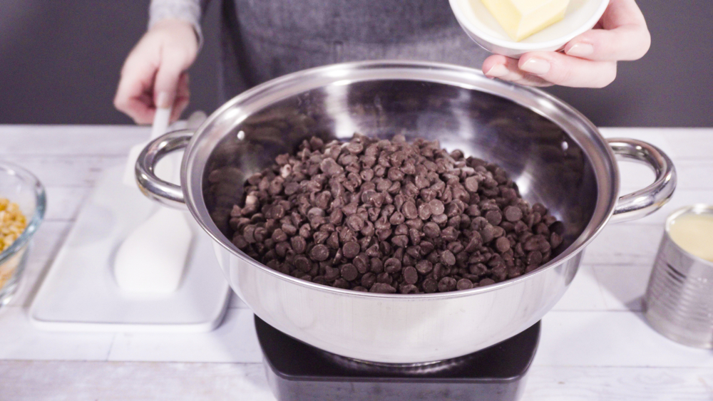 A bowl full of chocolate chips for making cannabis fudge