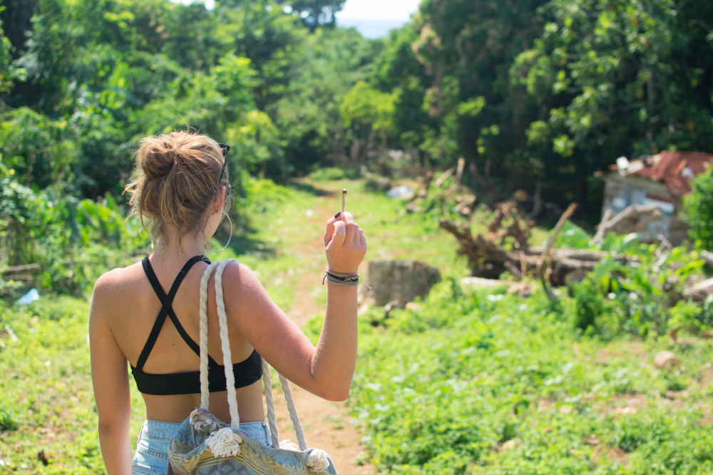Back view of woman smoking weed in Jamaica.